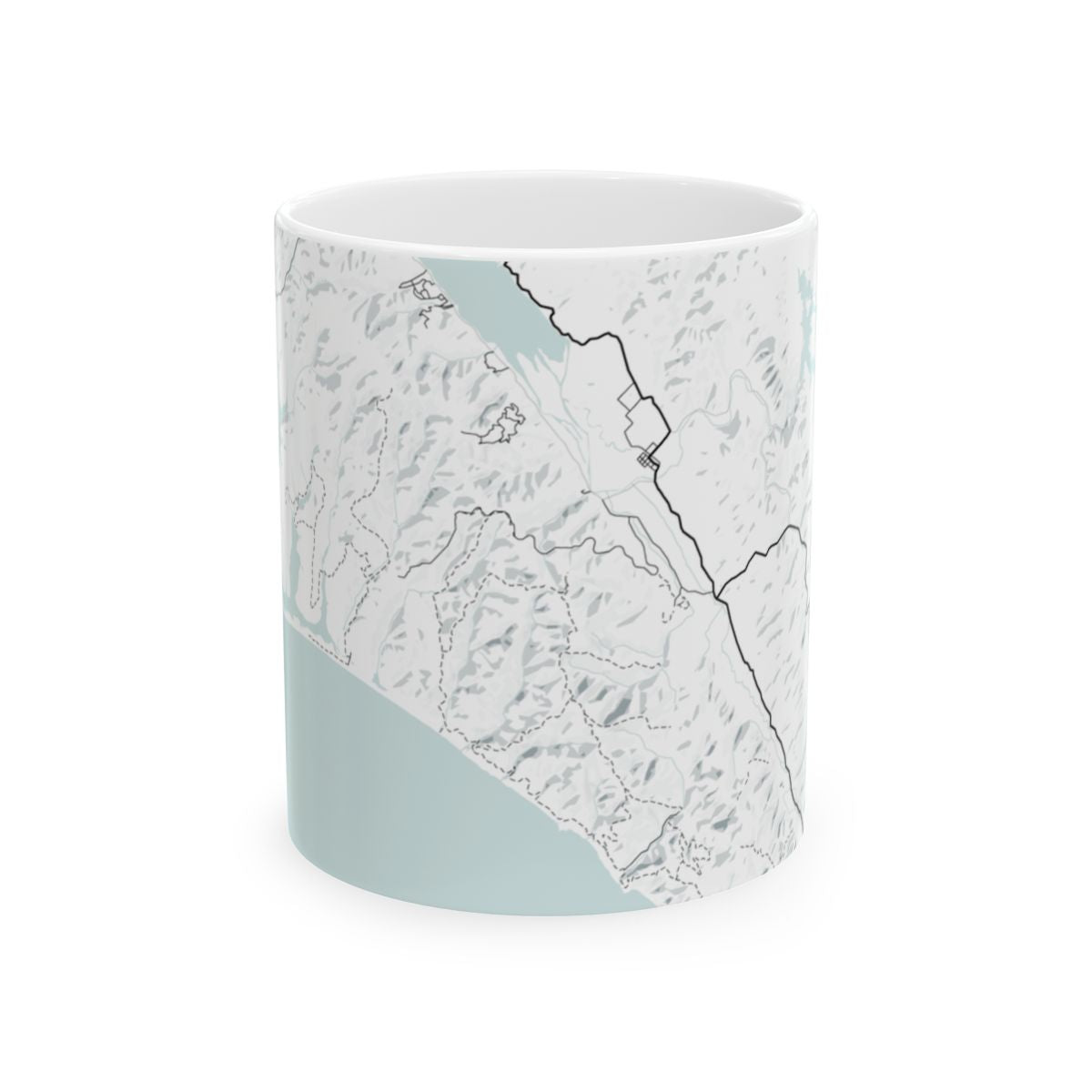 Ceramic mug with topographic map design on a white background