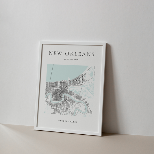 New Orleans Map for home or office decoration in lack white and ice blue pictured displayed against a wall. Created by Atlas & Ink Artistic Cartography Co. 